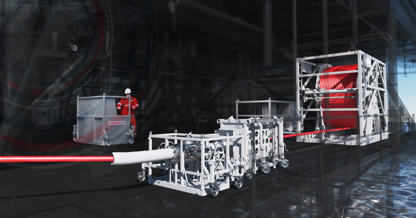Paradigm Flexi-Coil system with a red coil reel and industrial equipment